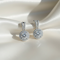 Earrings on ivory satin fabric