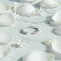 Ring on marble with petals