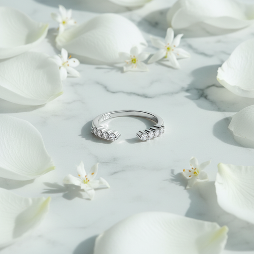 Ring on marble with petals