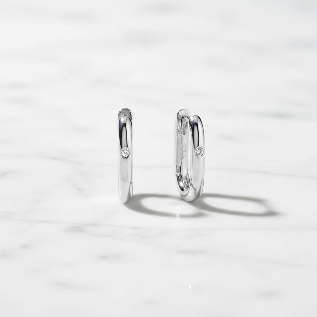 Silver hoops on marble